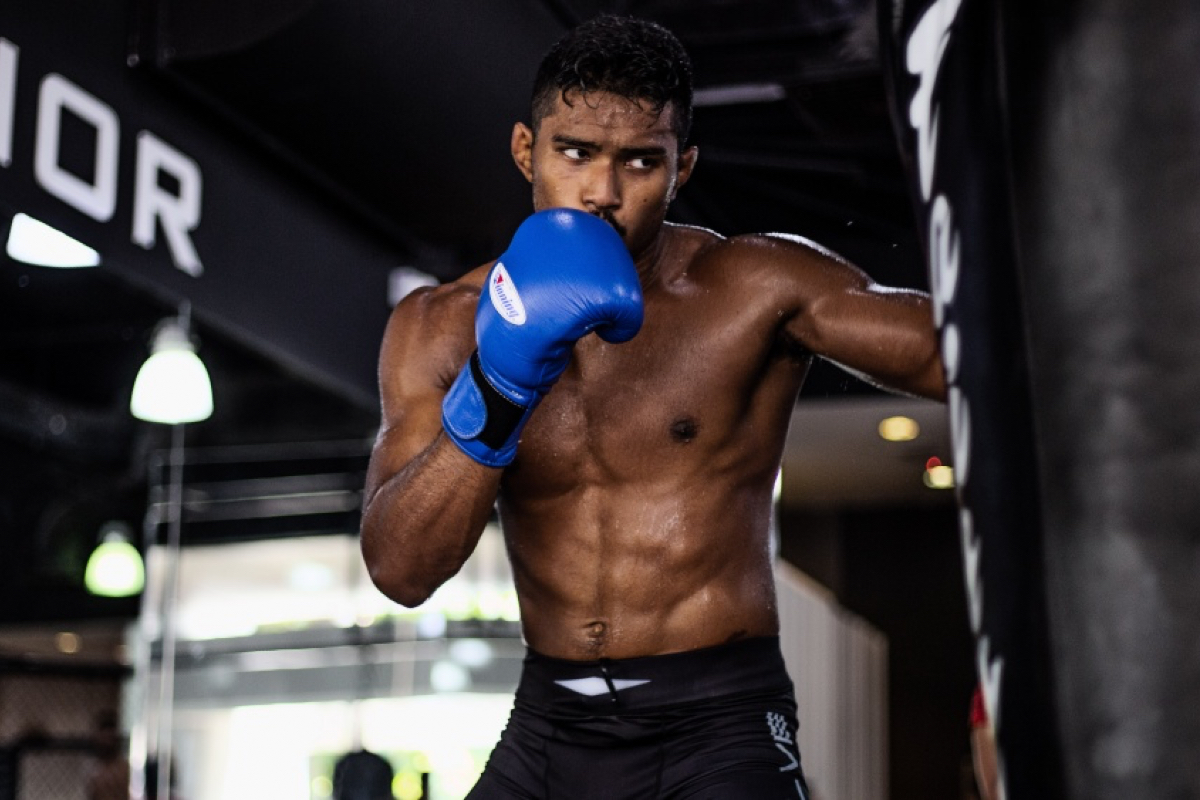 Amir Khan hits the heavybag at Evolve MMA